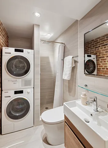 a view of a livingroom with furniture and stairs
