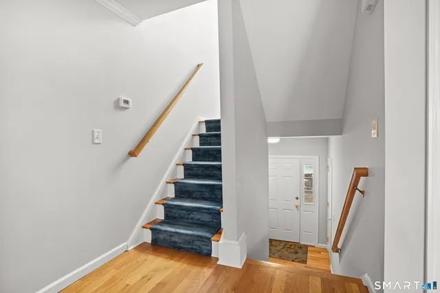 a view of entryway with wooden floor