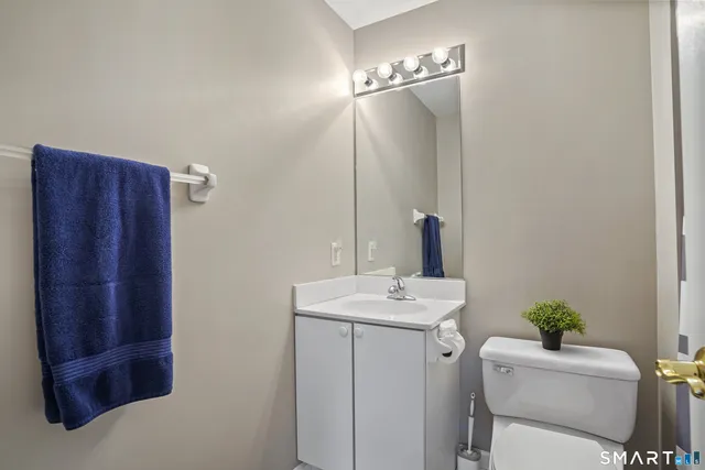 a bathroom with a sink vanity and mirror