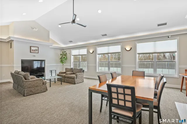 a view of a dining room with furniture window and outside view