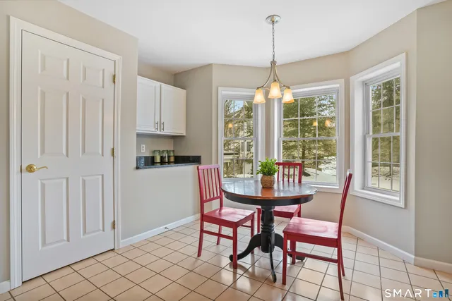 a dining room with furniture and window