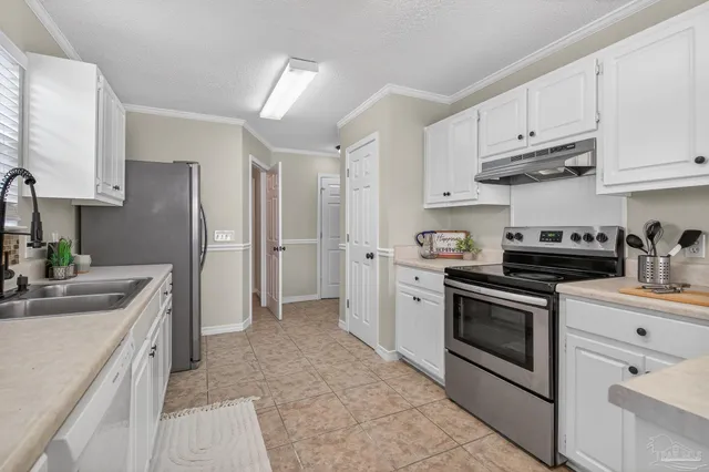 a kitchen with a stove and cabinets