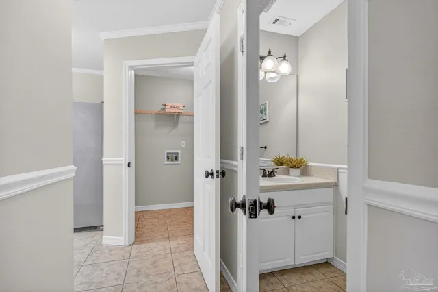 a chair and a stool in a room