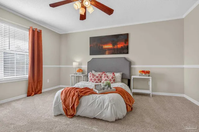 a view of a house with swimming pool and sitting area