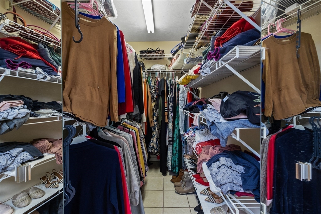 11 Patterson Road, Unit SF Lexington, MA 02421 - Photo 11 of 26 a view of walk in closet with clothes and shoes