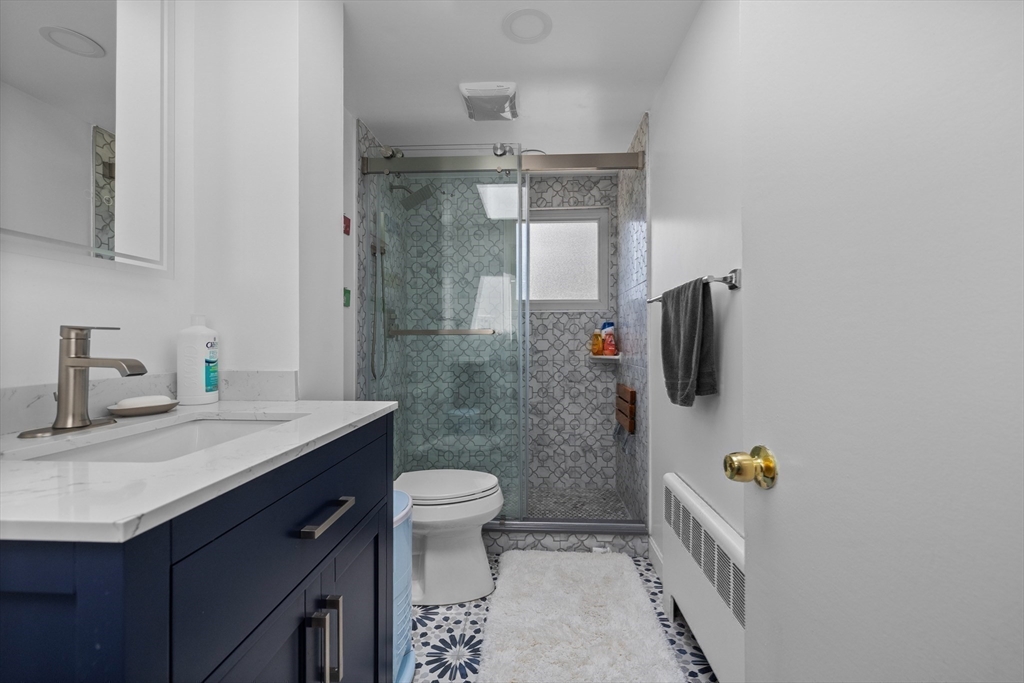 11 Patterson Road, Unit SF Lexington, MA 02421 - Photo 15 of 26 a bathroom with a sink and a mirror