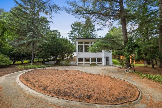 front view of a house with a garden