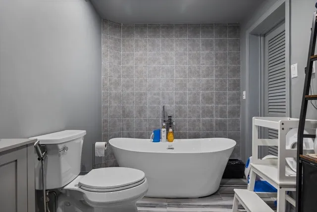 a living room with furniture a window and a fireplace