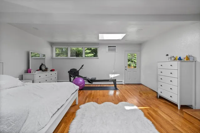 a bed room with a bed and a dresser