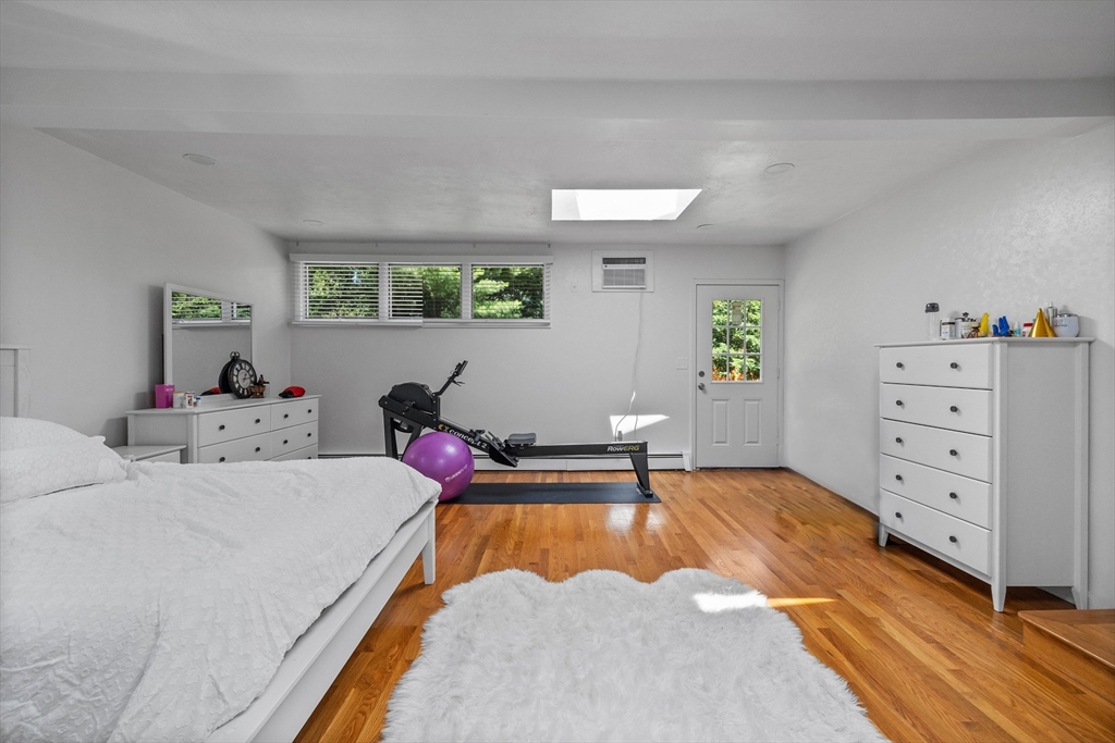 11 Patterson Road, Unit SF Lexington, MA 02421 - Photo 8 of 26 a bed room with a bed and a dresser