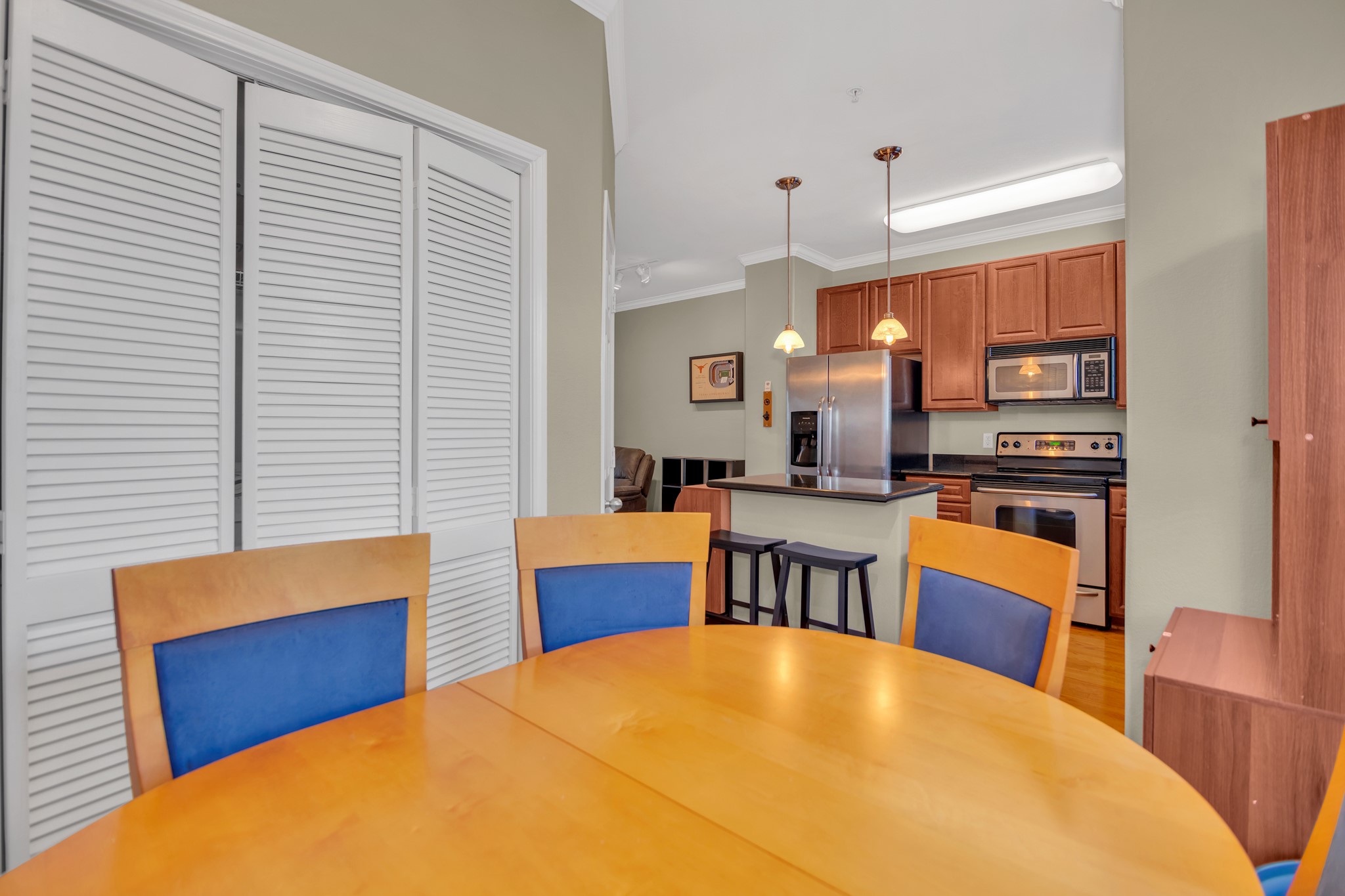 9200 Westheimer Road, Unit 1503 Houston, TX 77063 - Photo 16 of 37 a view of kitchen with dining room and wooden floor