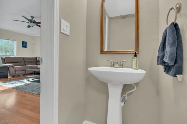 a bathroom with a sink and a mirror