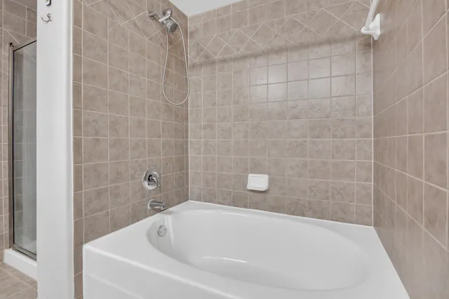 a white bath tub sitting in a bathroom