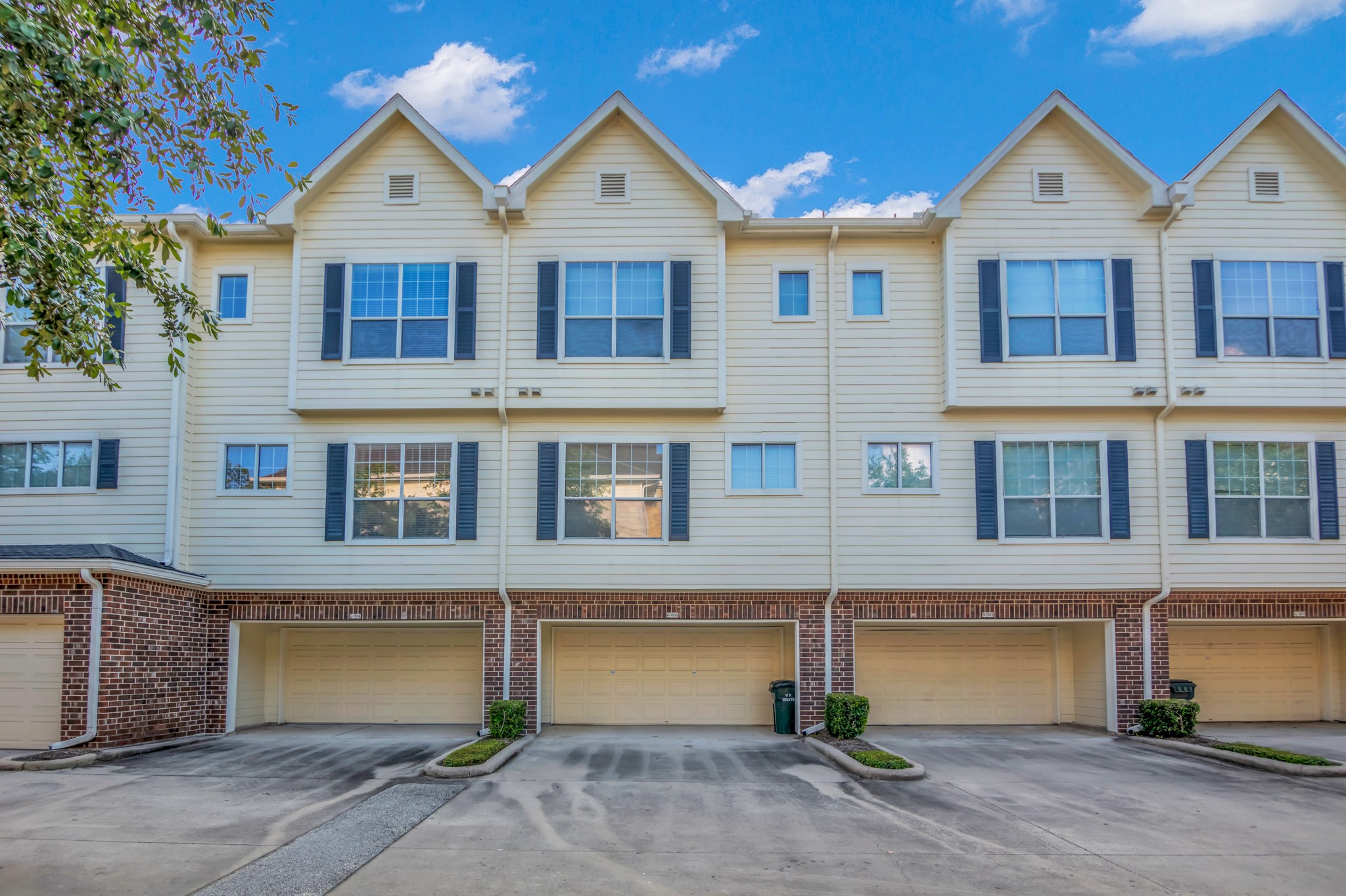 9200 Westheimer Road, Unit 1503 Houston, TX 77063 - Photo 33 of 37 a front view of a house with garage and parking