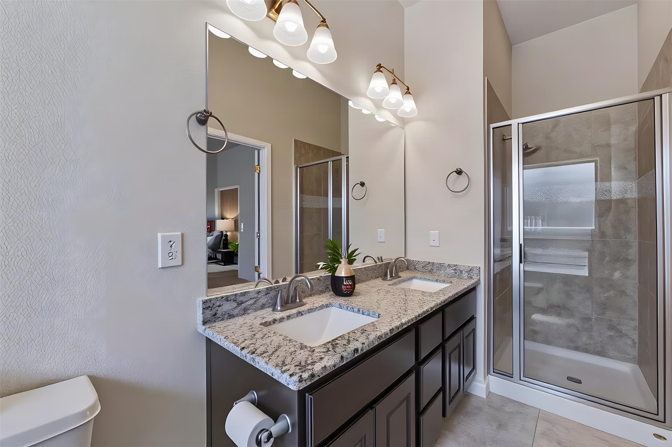 162 Rains Kyle, TX 78640 - Photo 17 of 32 Primary bathroom featuring granite counters and a dual vanity accent the spacious modern bathroom layout.