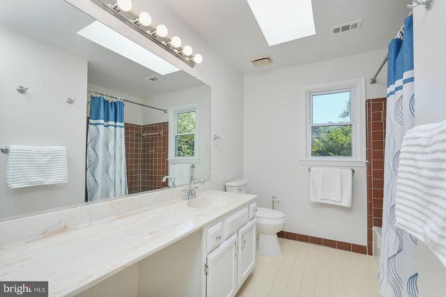 a bathroom with a sink double vanity and a mirror