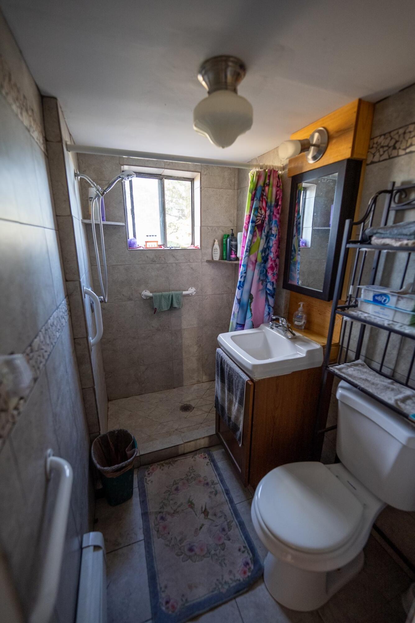 2122 County Road Norwood, CO 81423 - Photo 15 of 17 a bathroom with a toilet and a shower