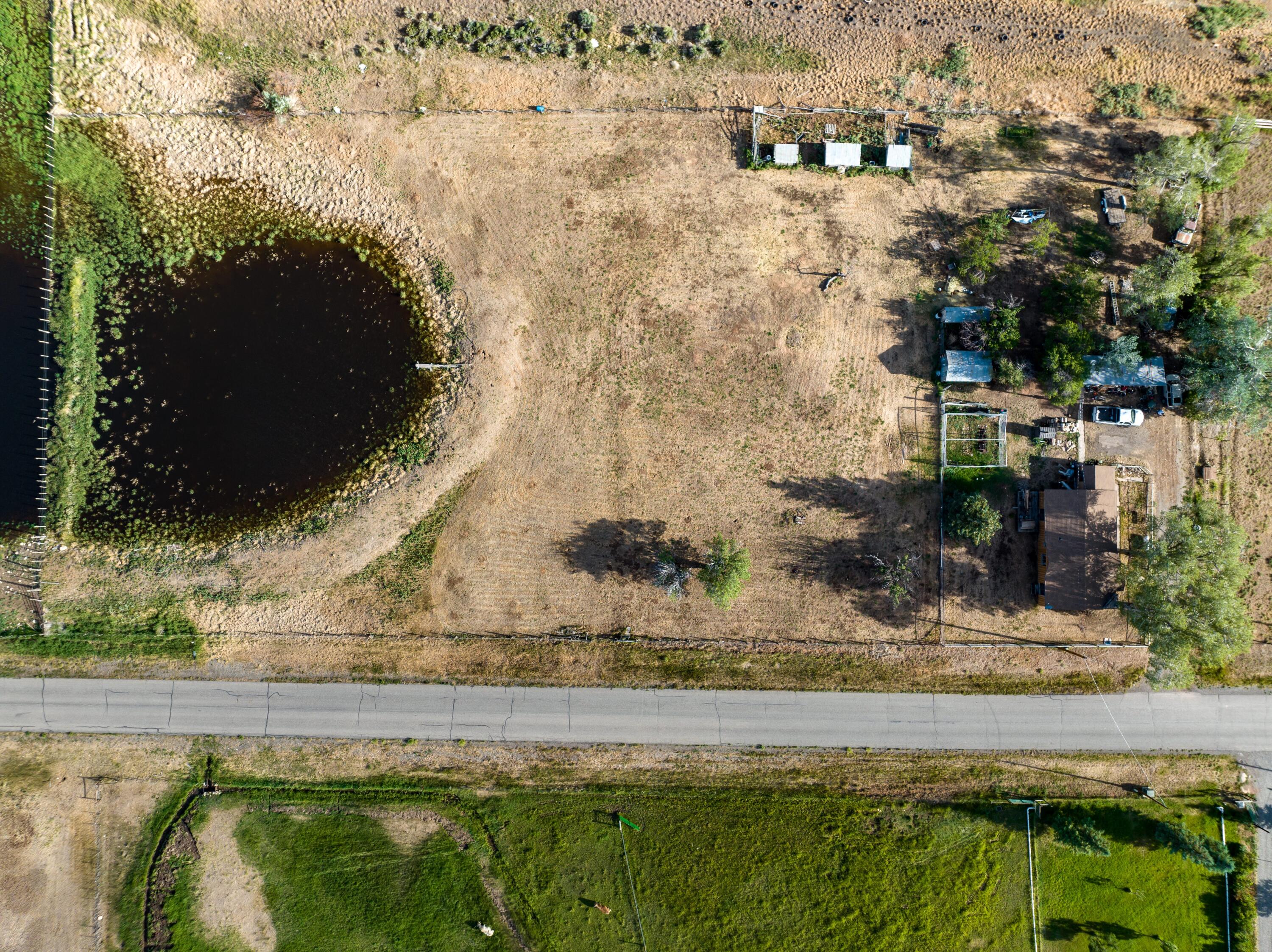 2122 County Road Norwood, CO 81423 - Photo 2 of 17 a view of swimming pool with a yard and seating area