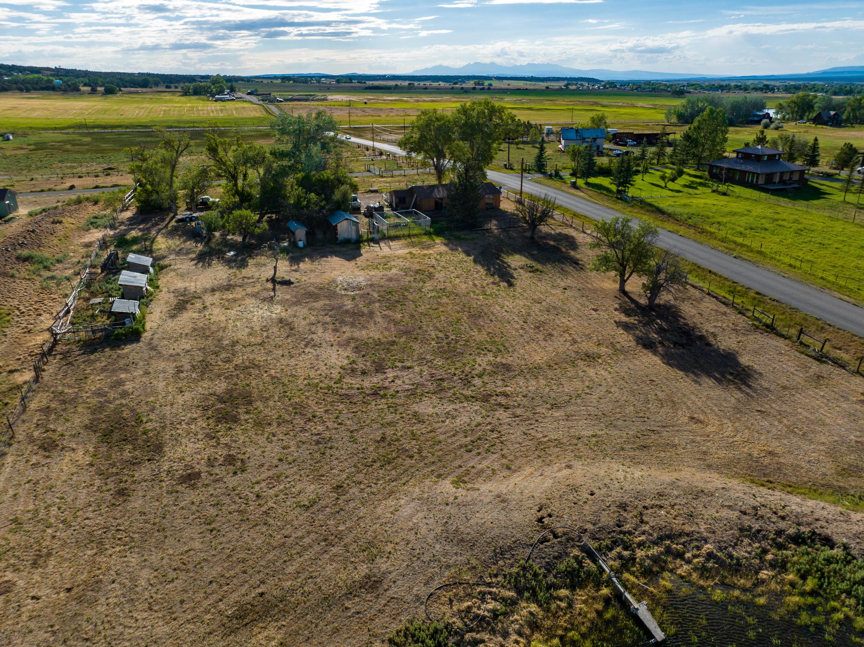 2122 County Road Norwood, CO 81423 - Photo 3 of 17 a view of a lake with a yard