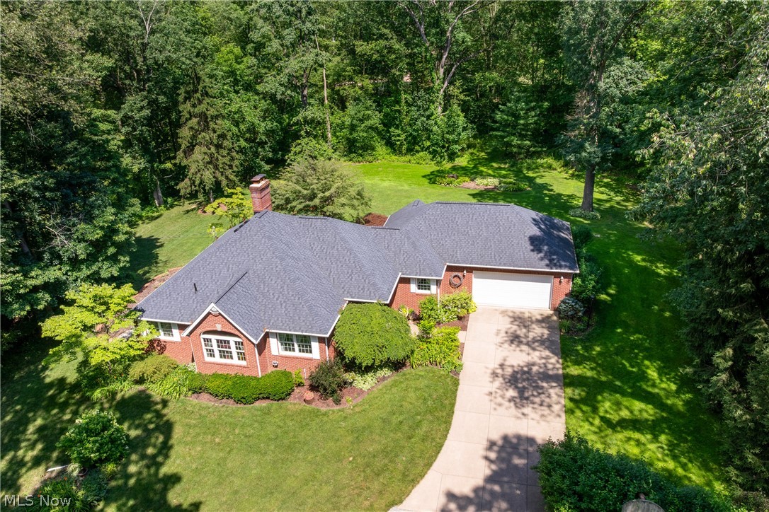 10400 Stoneacre Road Northwest Canal Fulton, OH 44614 - Photo 42 of 44 View from above of property with a heavily wooded area