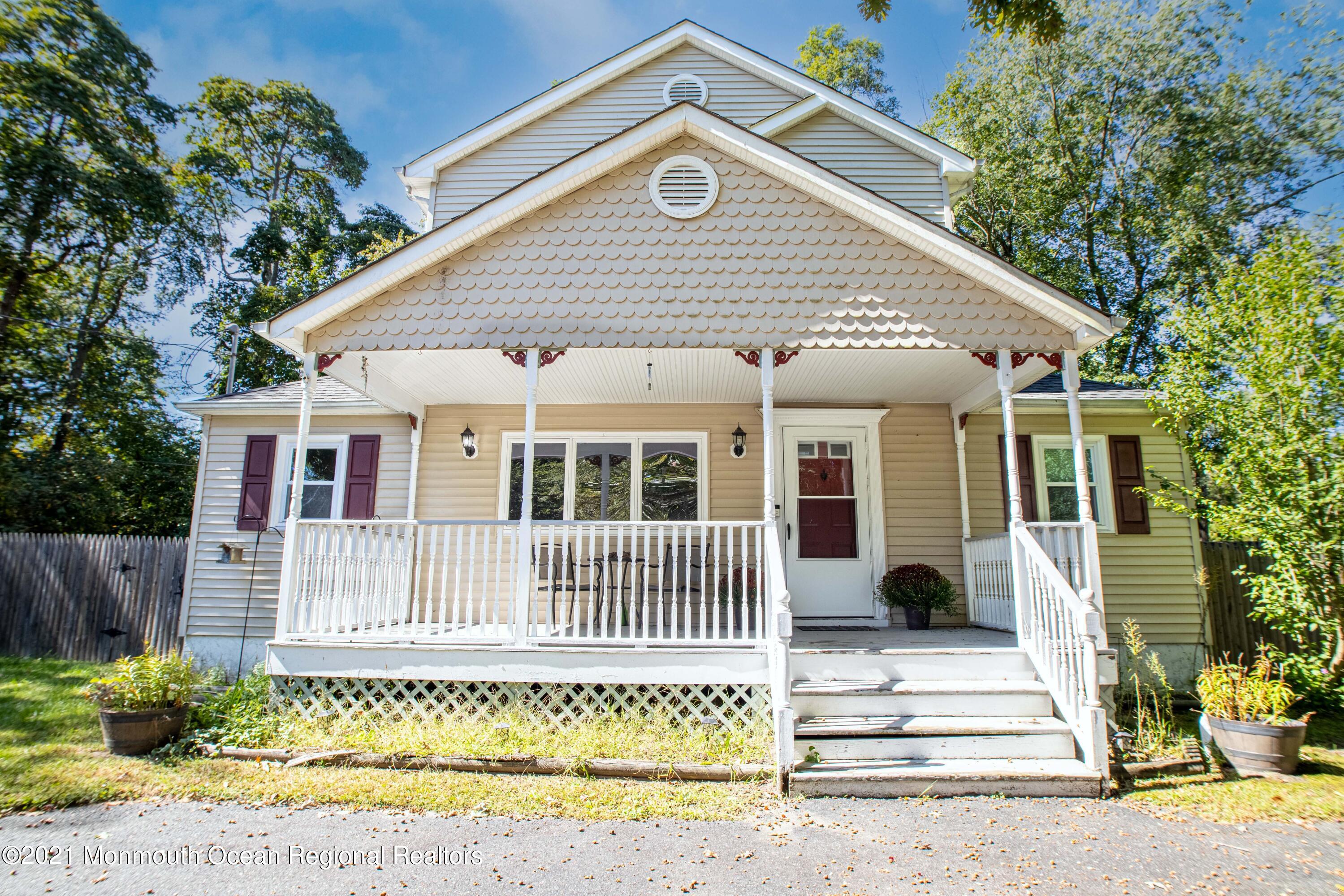 229 Lanes Pond Road Howell, NJ 07731 - Photo 2 of 25 a front view of a house with a garden