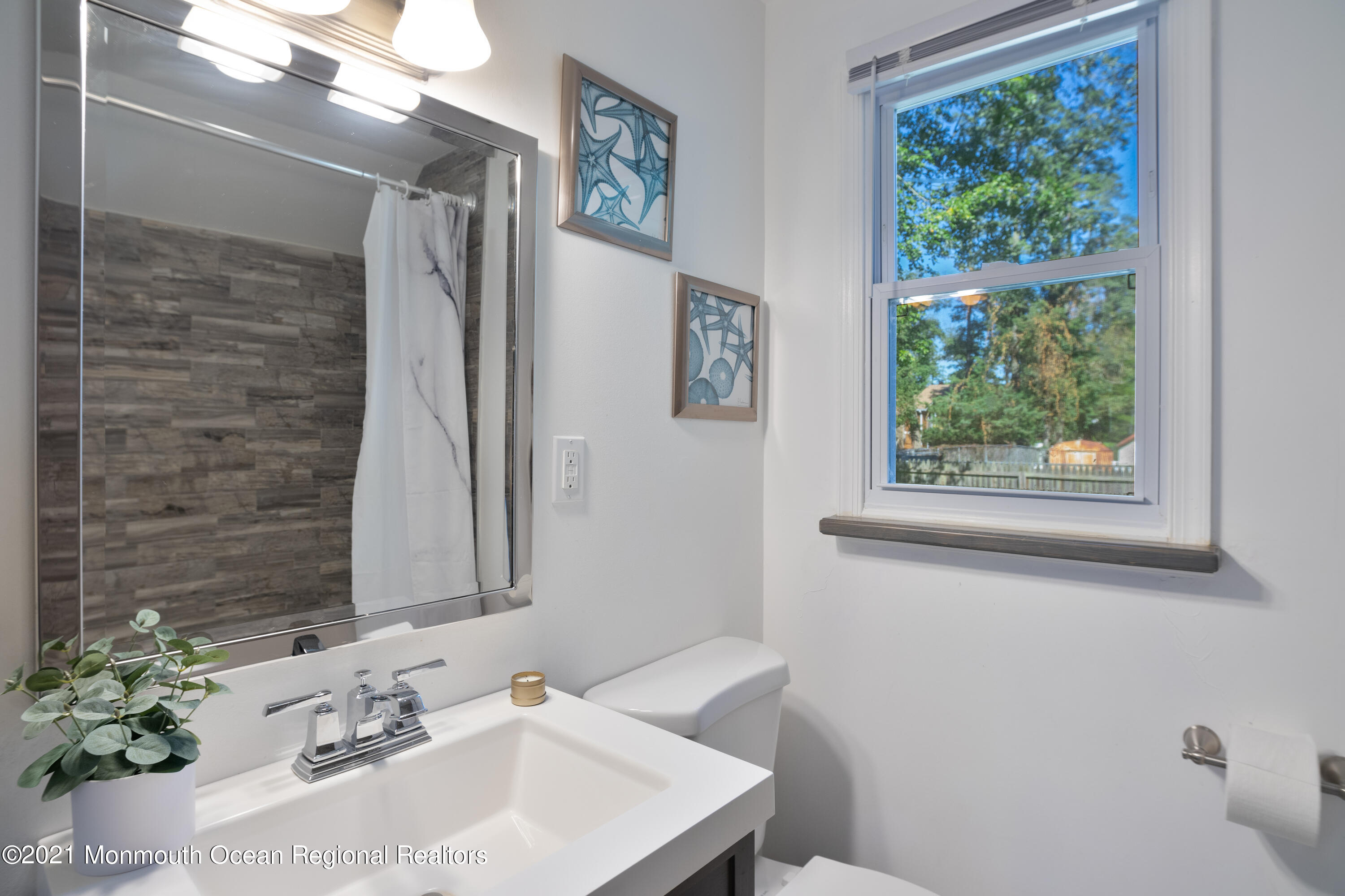 229 Lanes Pond Road Howell, NJ 07731 - Photo 15 of 25 a bathroom with a sink and a mirror