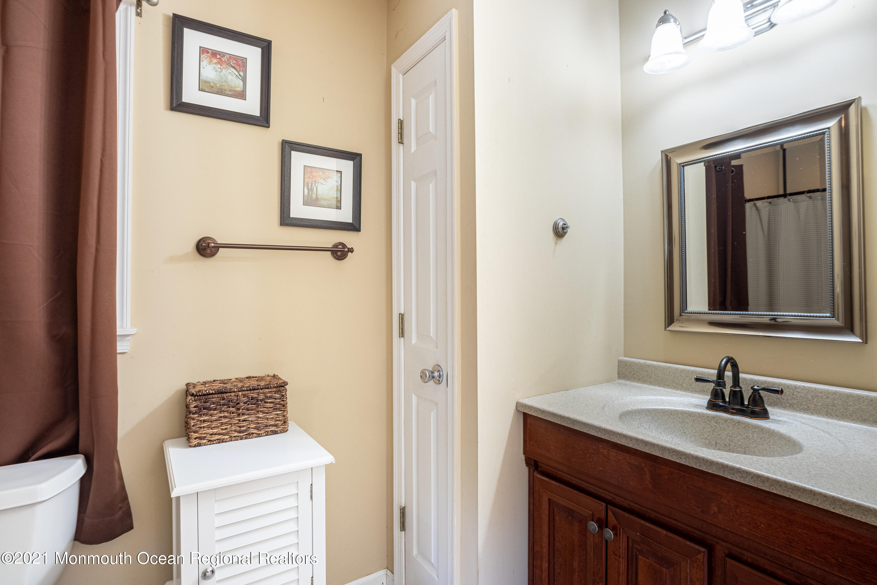 229 Lanes Pond Road Howell, NJ 07731 - Photo 22 of 25 a bathroom with a sink and a mirror