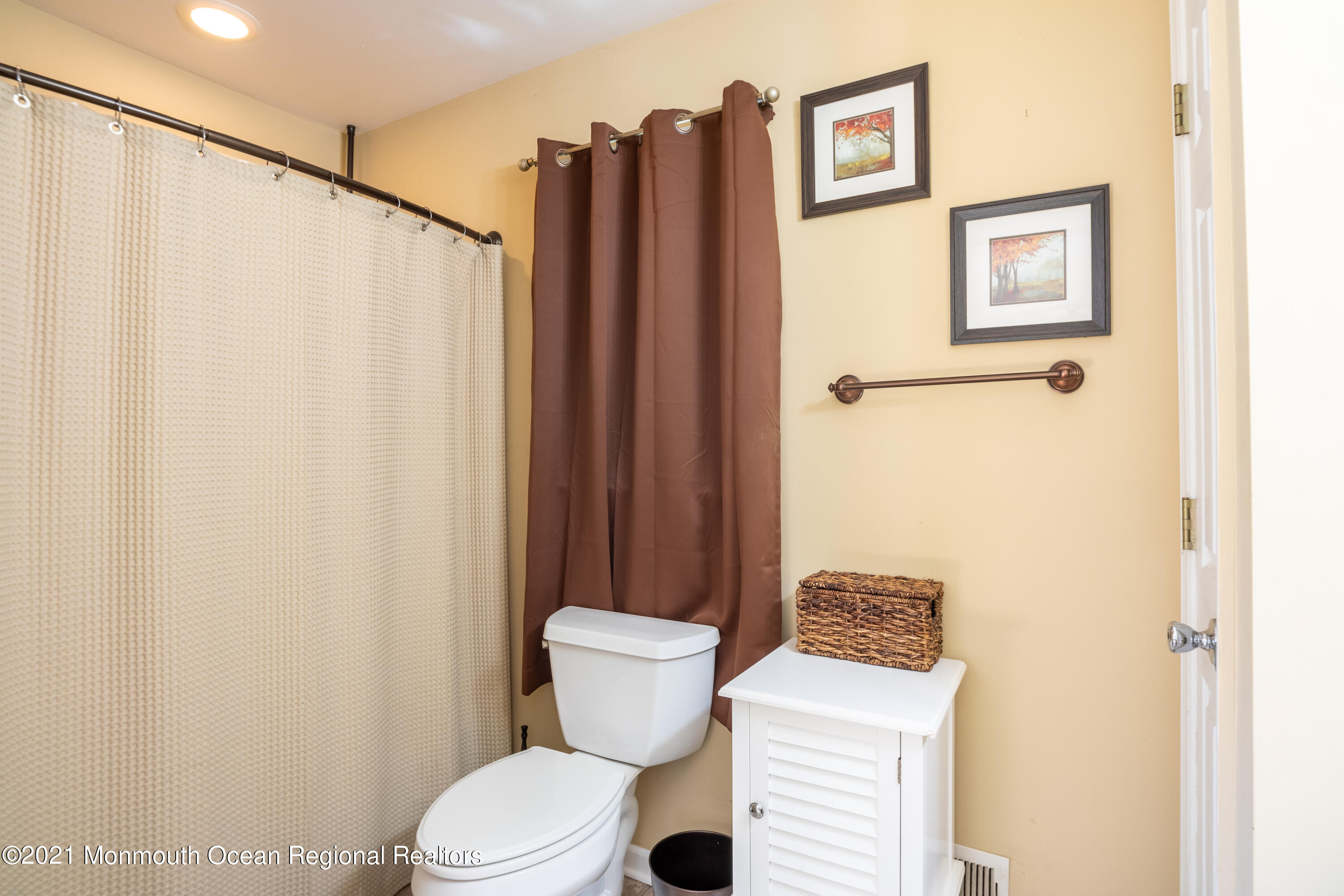 229 Lanes Pond Road Howell, NJ 07731 - Photo 23 of 25 a bathroom with a toilet and a shower curtain