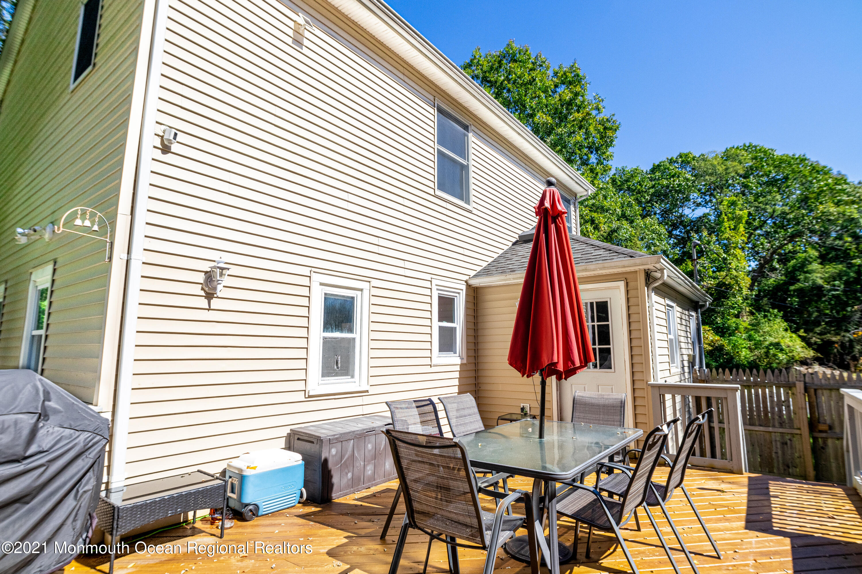 229 Lanes Pond Road Howell, NJ 07731 - Photo 5 of 25 a view of a patio with a table and chairs and a barbeque