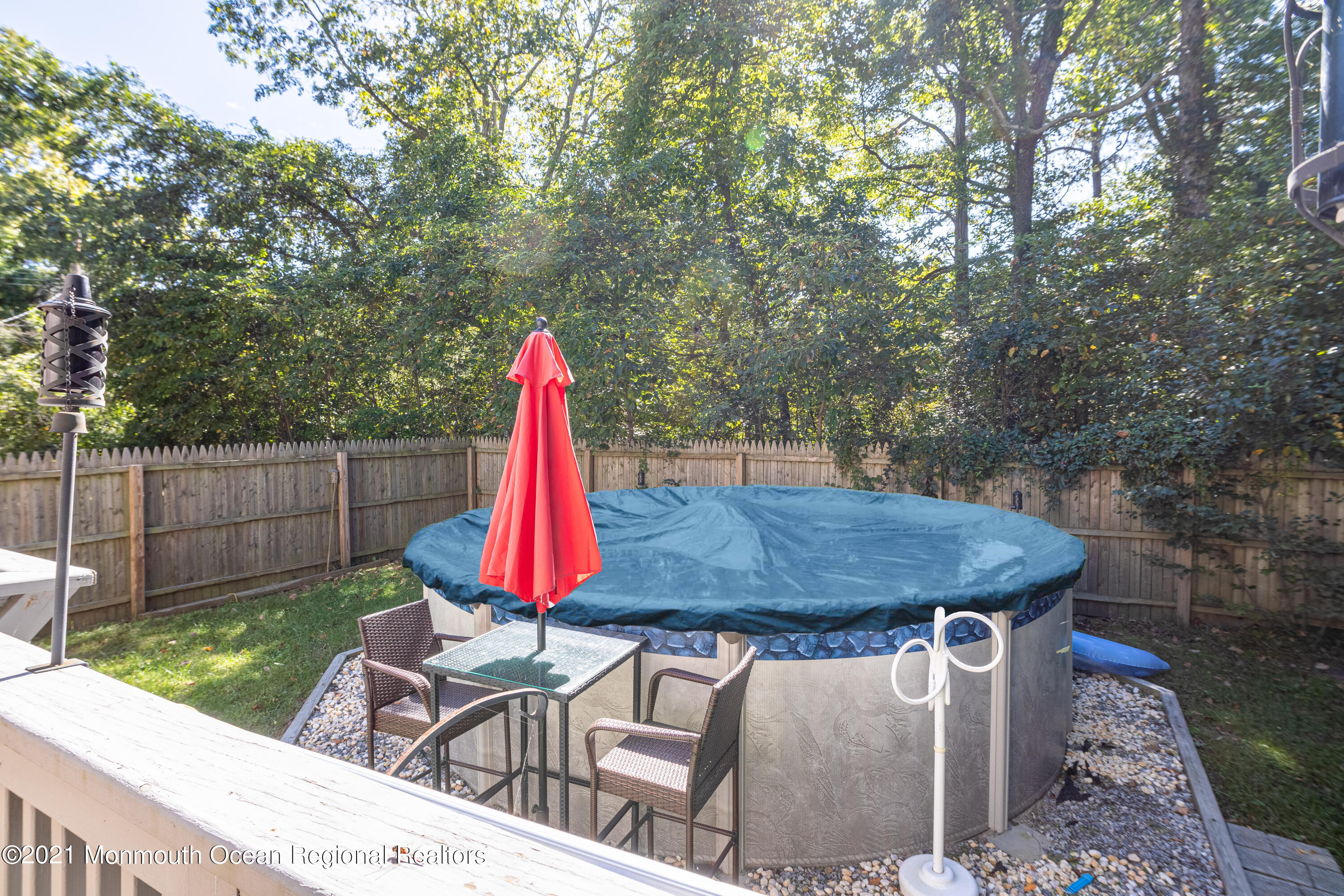 229 Lanes Pond Road Howell, NJ 07731 - Photo 6 of 25 a view of a backyard with table and chairs