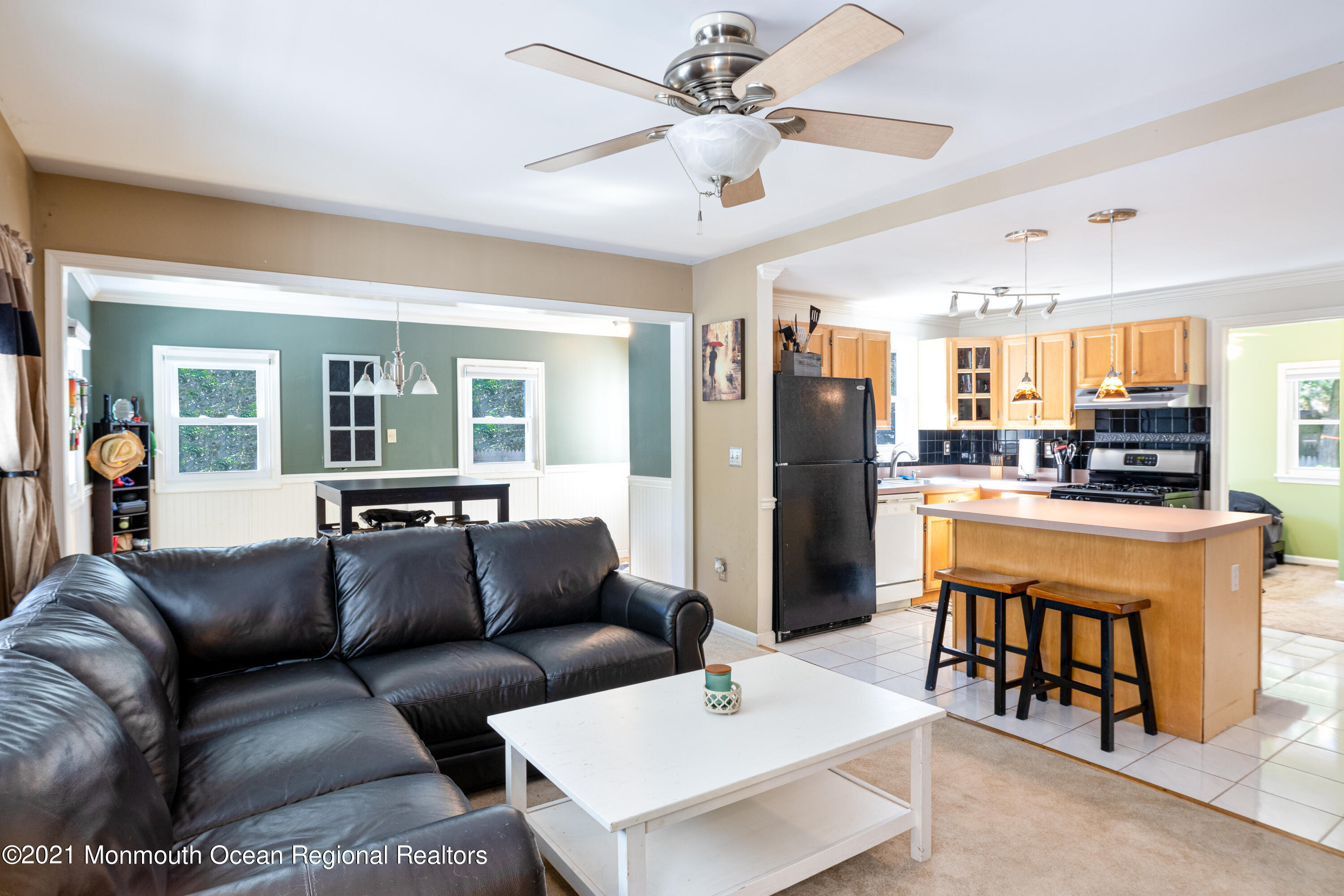 229 Lanes Pond Road Howell, NJ 07731 - Photo 9 of 25 a living room with stainless steel appliances kitchen island granite countertop furniture and a view of kitchen
