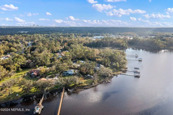 a view of a lake with houses in the back