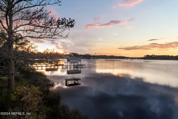 a view of a big yard with table and chairs