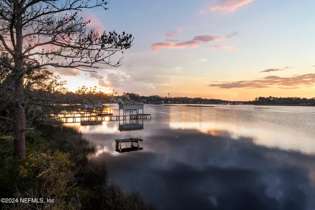 a view of a big yard with table and chairs