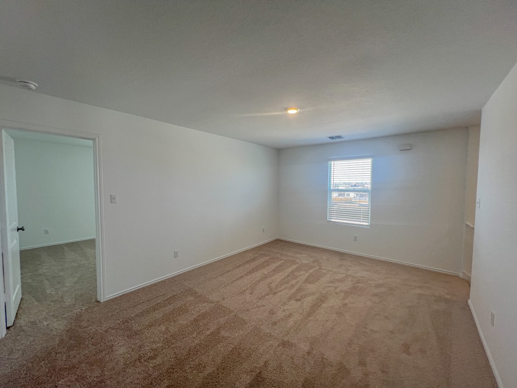 254 The Bad Way Jarrell, TX 76537 - Photo 13 of 24 an empty room with a window