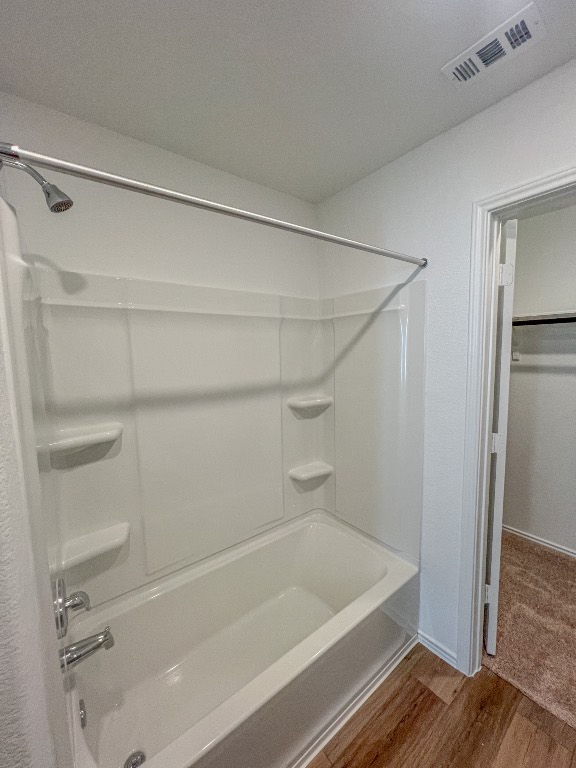 254 The Bad Way Jarrell, TX 76537 - Photo 16 of 24 a bathroom with a shower and a bath tub