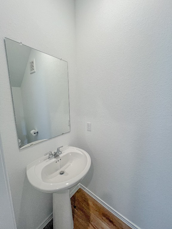 254 The Bad Way Jarrell, TX 76537 - Photo 4 of 24 a bathroom with a sink and mirror