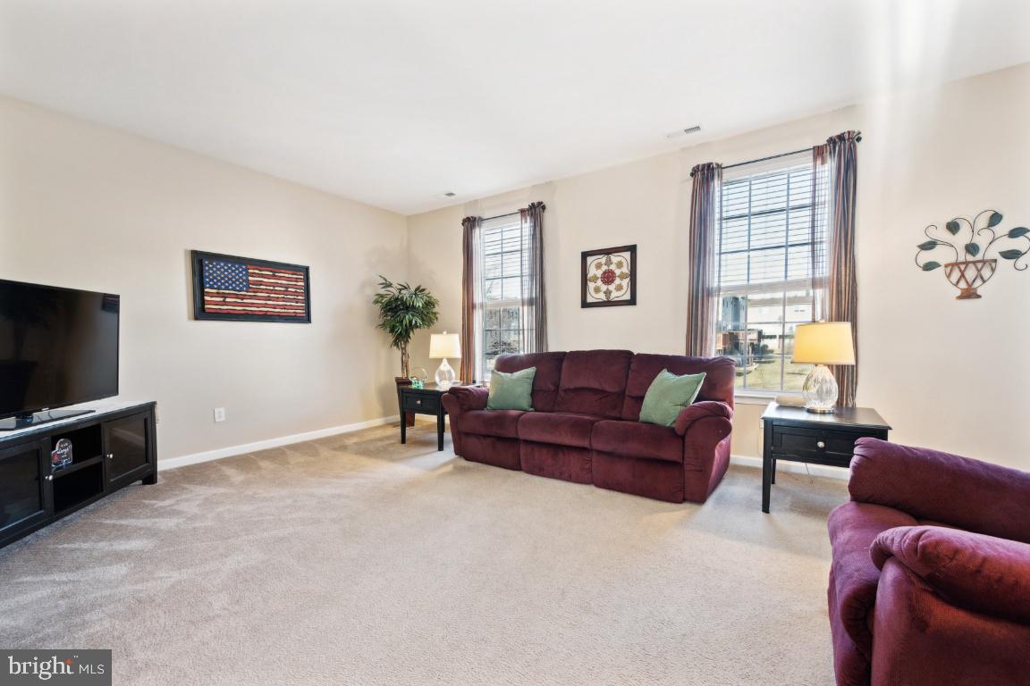 12 Wallace Road Mount Holly, NJ 08060 - Photo 12 of 25 a living room with furniture and a flat screen tv