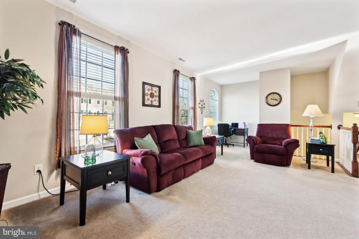 12 Wallace Road Mount Holly, NJ 08060 - Photo 13 of 25 a living room with furniture and a lamp