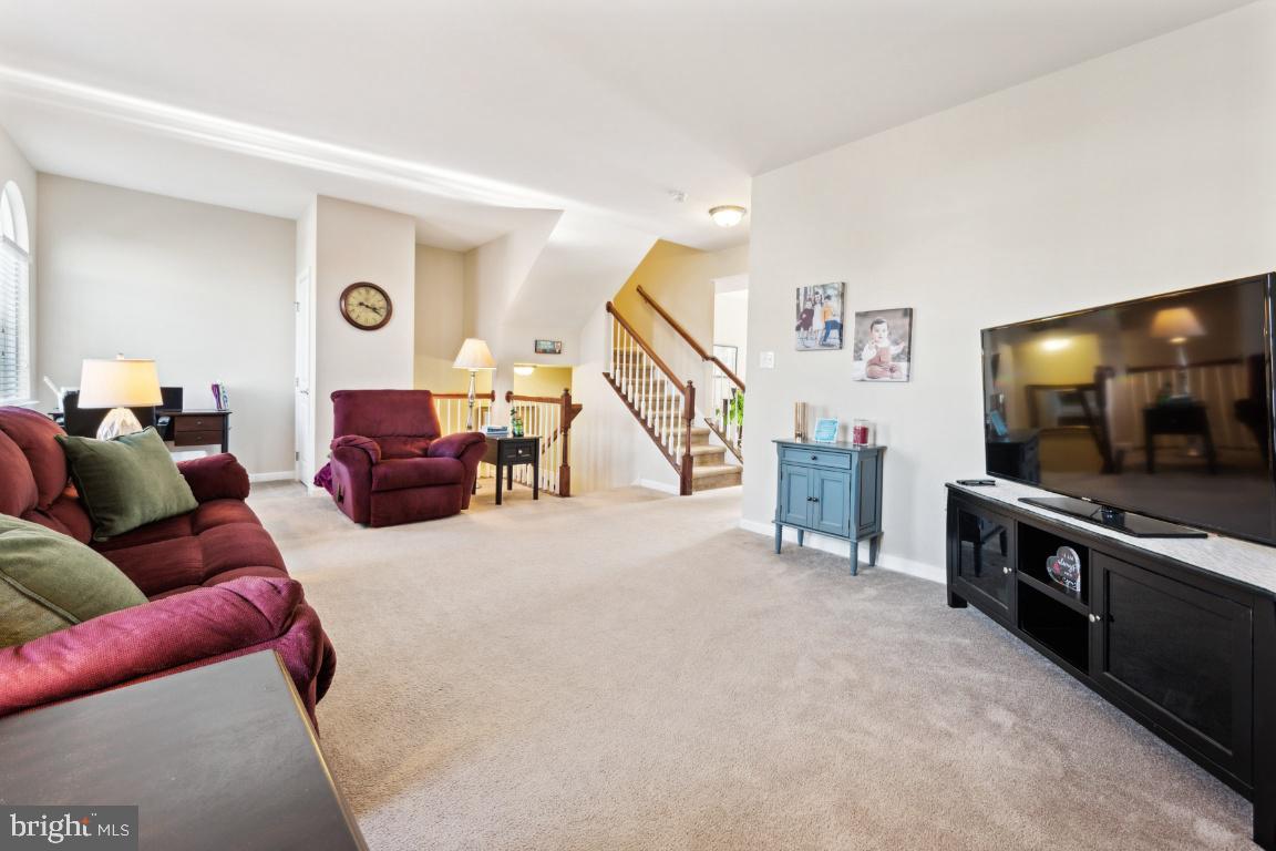 12 Wallace Road Mount Holly, NJ 08060 - Photo 14 of 25 a living room with furniture and a flat screen tv