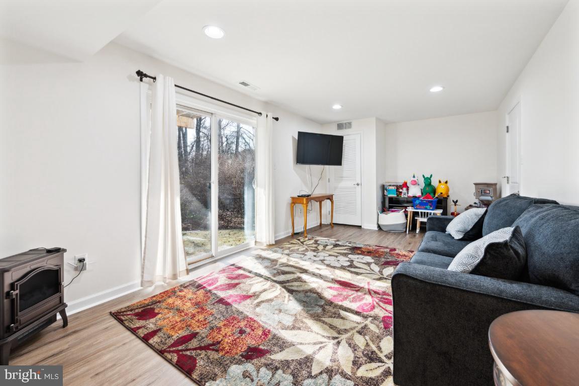 12 Wallace Road Mount Holly, NJ 08060 - Photo 17 of 25 a bed room with a bed a couch and a window