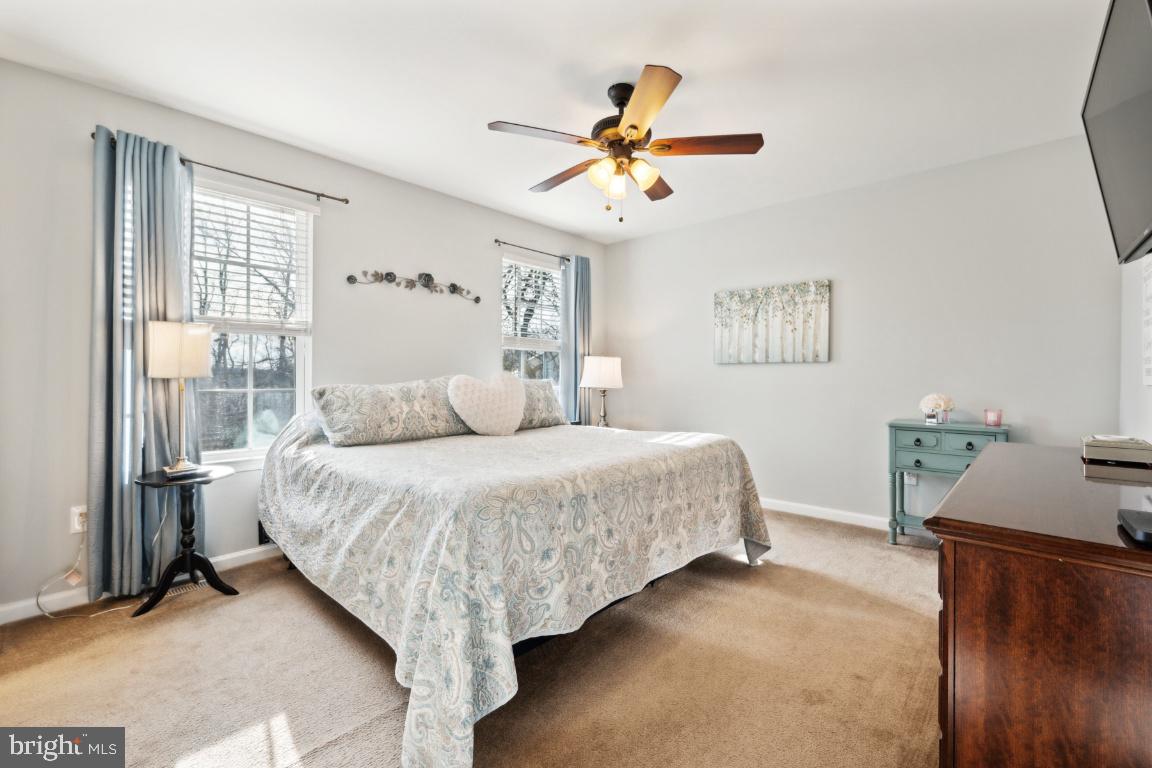 12 Wallace Road Mount Holly, NJ 08060 - Photo 18 of 25 a bedroom with a bed and a chandelier