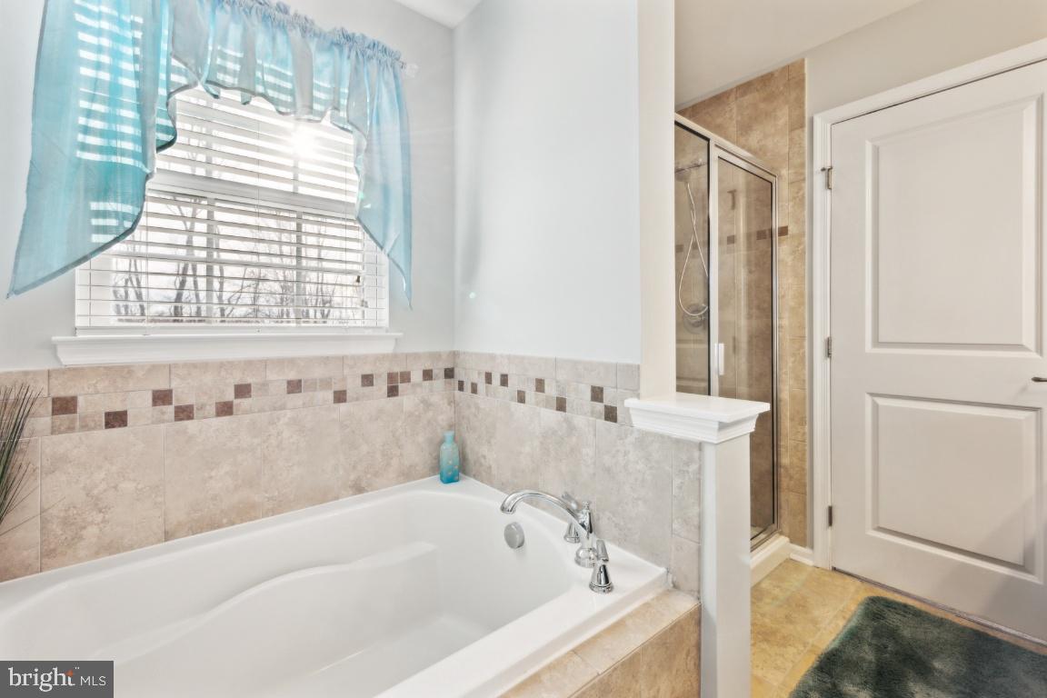 12 Wallace Road Mount Holly, NJ 08060 - Photo 19 of 25 a bathroom with bathtub and window