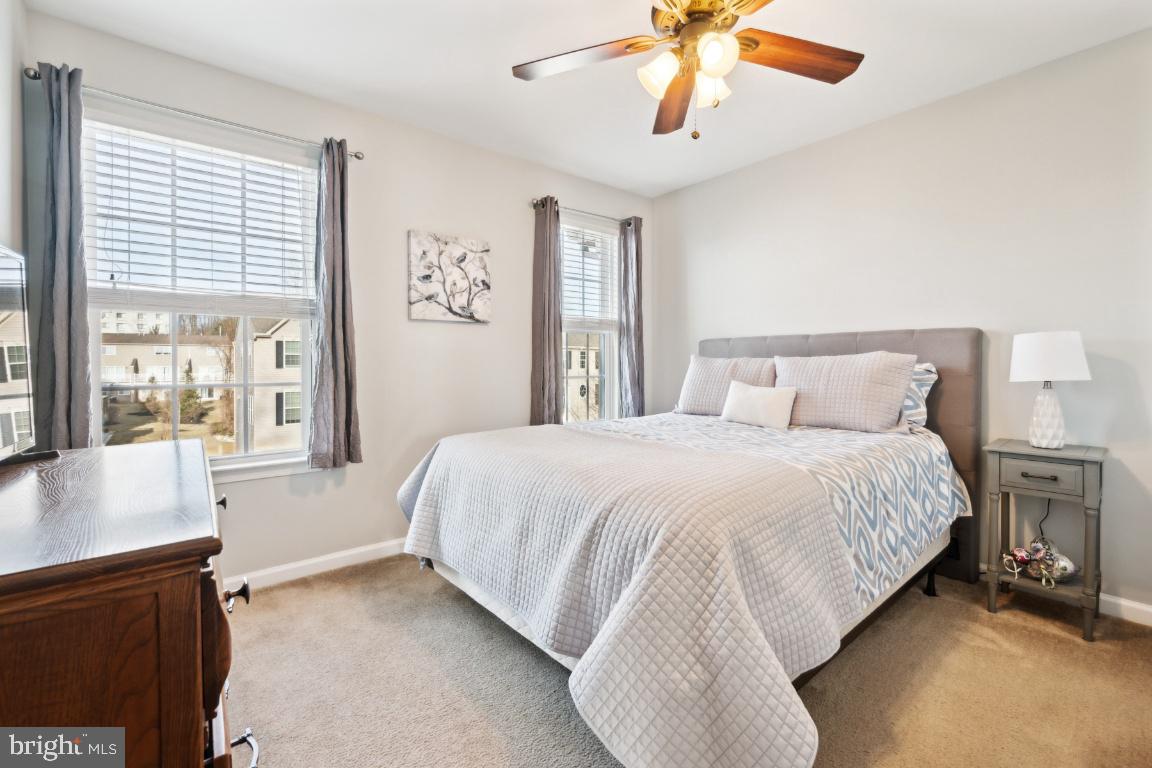 12 Wallace Road Mount Holly, NJ 08060 - Photo 23 of 25 a bedroom with a large bed and a chandelier