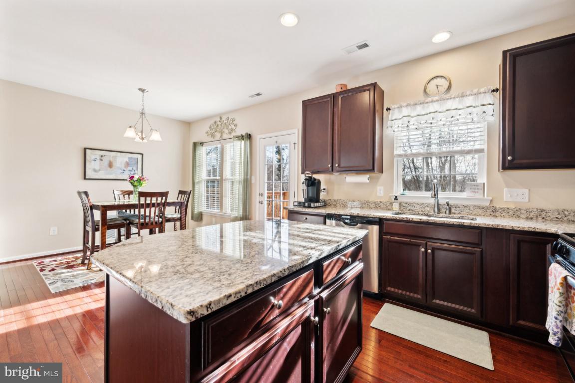 12 Wallace Road Mount Holly, NJ 08060 - Photo 4 of 25 a kitchen with stainless steel appliances granite countertop a kitchen island hardwood floor sink stove and granite counter top