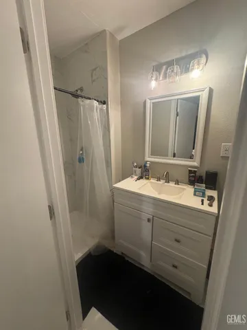 a bathroom with a double vanity sink and mirror