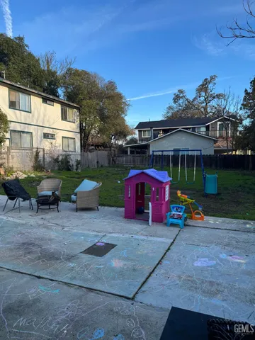 a view of outdoor space with seating area and swimming pool