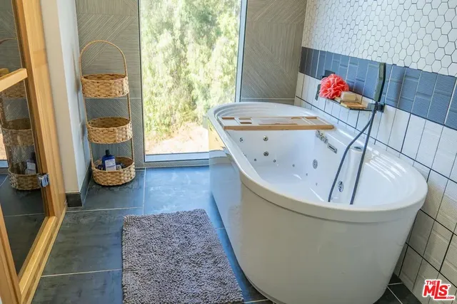 a view of a dining room with furniture and a large window