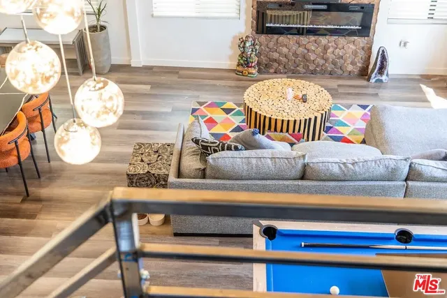 a view of an chairs and backyard in the backyard