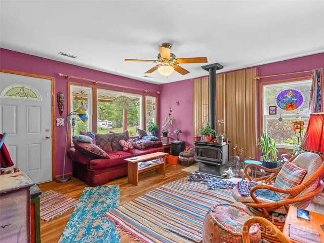 a living room with patio furniture and a window